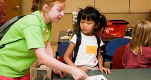 PHOTO: Teacher helping child